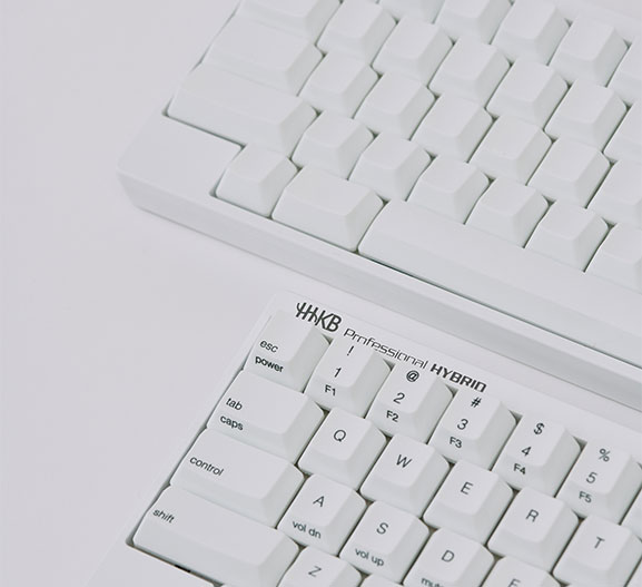 HHKB HYBRID Type S Snow printed and blank keyboards close up